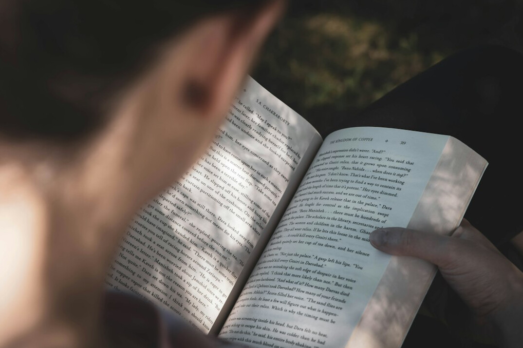 woman reading mystery book