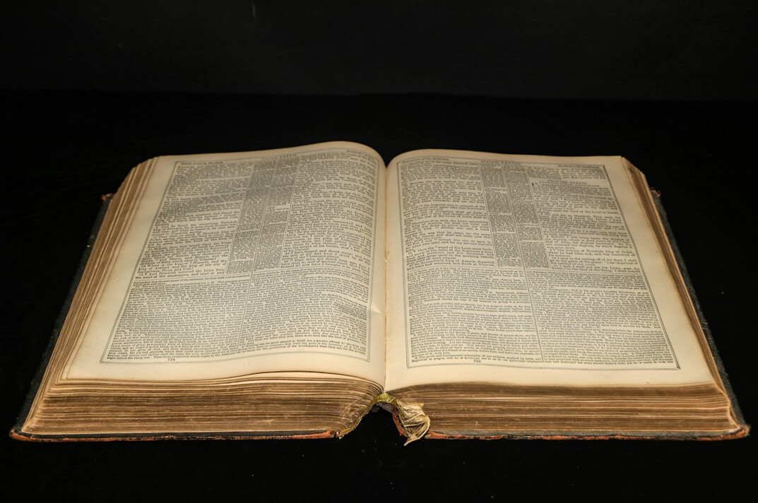 old book open on table